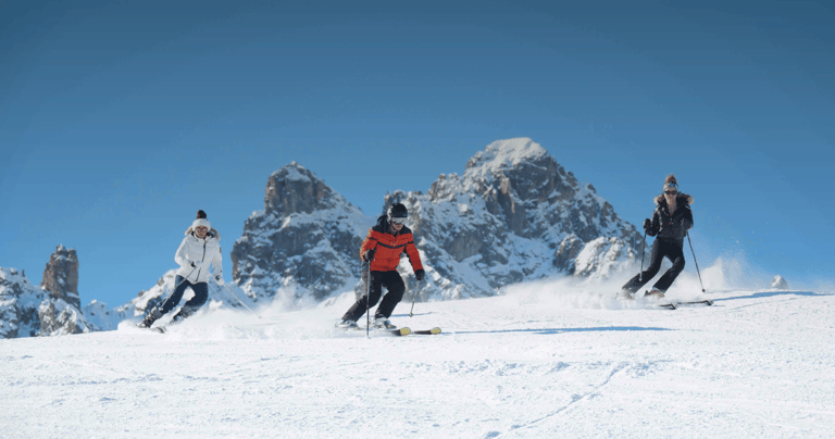 Skiers on the 3 Valleys slopes facing the peaks